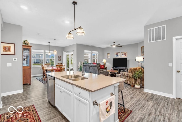 9470 Tobin Cir, Avon, IN 46123 - kitchen featuring a ceiling fan, dishwasher, wood finished floors, white cabinets, and open floor plan