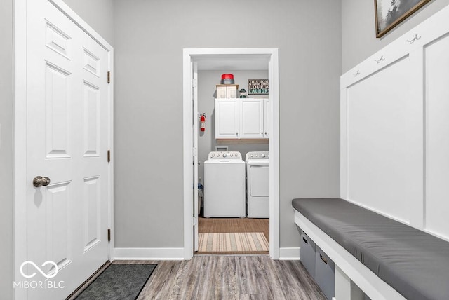 9470 Tobin Cir, Avon, IN 46123 - laundry room with washer and dryer, cabinet space, and wood finished floors