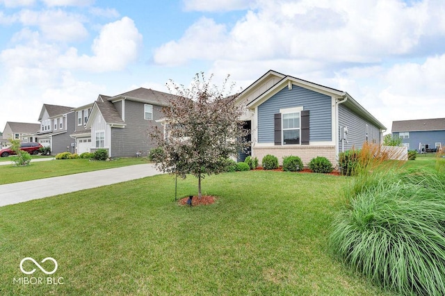 9470 Tobin Cir, Avon, IN 46123 - view of front of home with driveway, brick siding, a front yard, and a residential view
