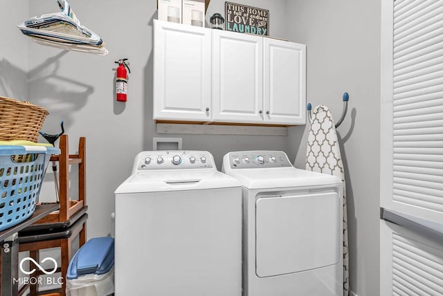 9470 Tobin Cir, Avon, IN 46123 - laundry area featuring washer and dryer and cabinet space