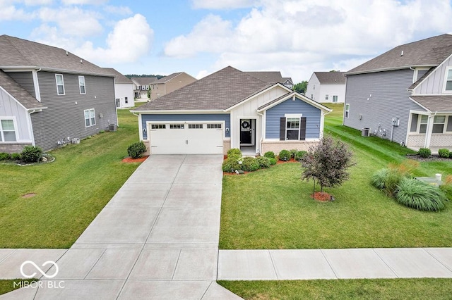 9470 Tobin Cir, Avon, IN 46123 - view of front facade with driveway, a garage, board and batten siding, and a front yard