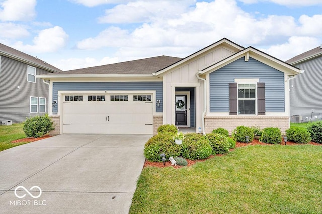 9470 Tobin Cir, Avon, IN 46123 - ranch-style home featuring board and batten siding, a garage, driveway, a front lawn, and brick siding