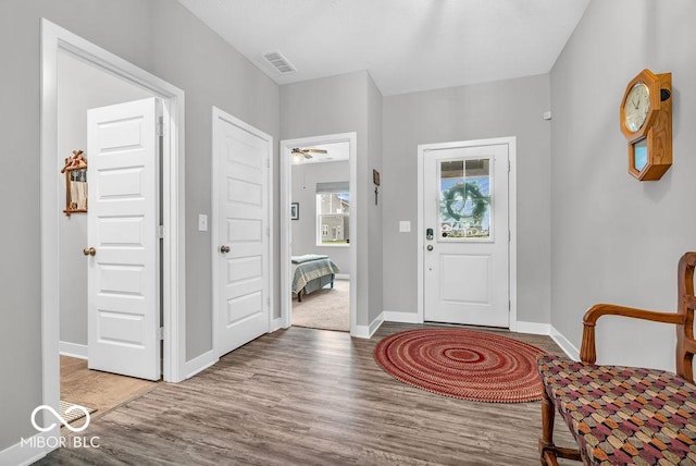 9470 Tobin Cir, Avon, IN 46123 - foyer entrance with wood finished floors and a ceiling fan