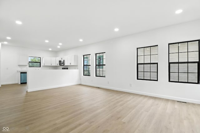 3455 N Illinois St, Indianapolis, IN 46208 - unfurnished living room with light wood-style floors and recessed lighting