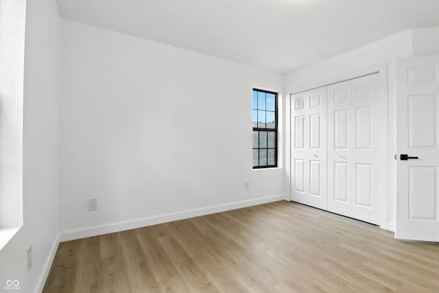 3455 N Illinois St, Indianapolis, IN 46208 - unfurnished bedroom with light wood-style flooring and a closet