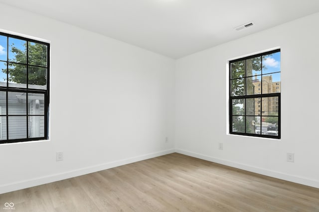 3455 N Illinois St, Indianapolis, IN 46208 - spare room featuring light wood-style floors and baseboards