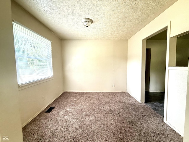3034 E 35th St, Indianapolis, IN 46218 - carpeted empty room with a textured ceiling