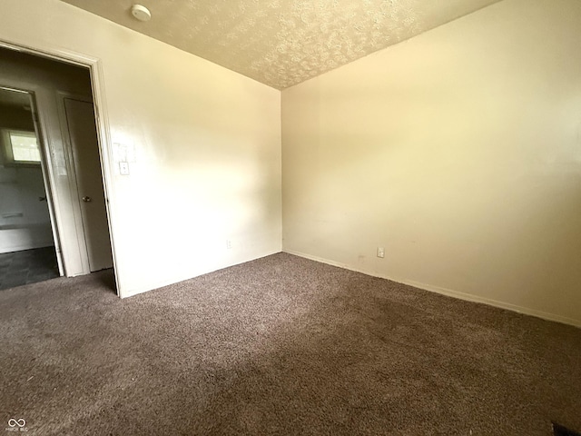 3034 E 35th St, Indianapolis, IN 46218 - carpeted spare room with a smoke detector and a textured ceiling