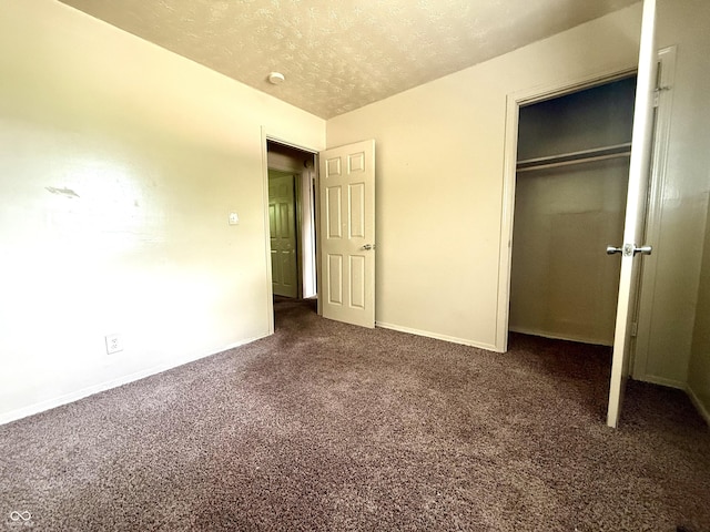 3034 E 35th St, Indianapolis, IN 46218 - unfurnished bedroom with carpet flooring, a textured ceiling, and a closet