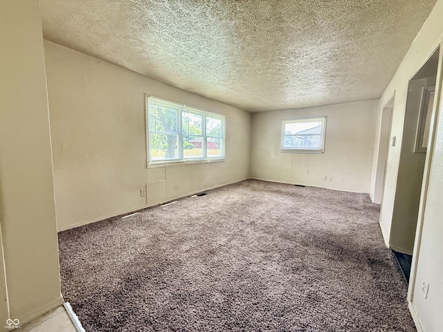 3034 E 35th St, Indianapolis, IN 46218 - carpeted empty room featuring a textured ceiling