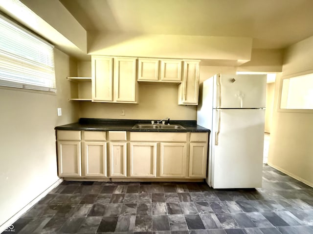 3034 E 35th St, Indianapolis, IN 46218 - kitchen featuring freestanding refrigerator, open shelves, dark countertops, and dark stone finish floors