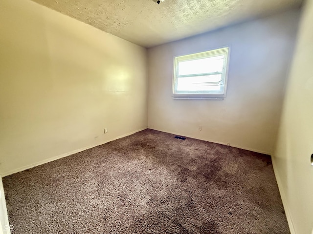 3034 E 35th St, Indianapolis, IN 46218 - unfurnished room with carpet floors and a textured ceiling