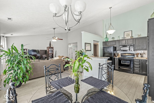 577 Austrian Way, Avon, IN 46123 - dining room with lofted ceiling, light wood-type flooring, a ceiling fan, a chandelier, and a textured ceiling