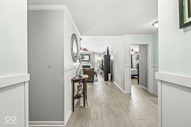 577 Austrian Way, Avon, IN 46123 - corridor with a textured ceiling, light wood-style floors, and ornamental molding