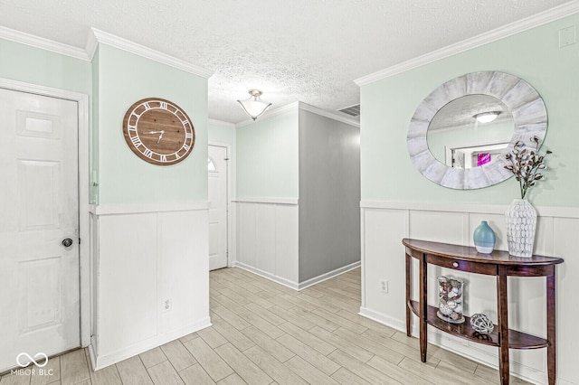 577 Austrian Way, Avon, IN 46123 - hallway with a textured ceiling, a wainscoted wall, wood finished floors, and a decorative wall