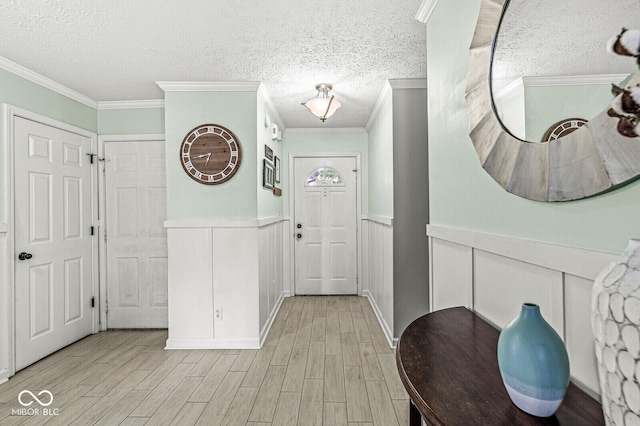 577 Austrian Way, Avon, IN 46123 - entryway featuring a textured ceiling, a wainscoted wall, a decorative wall, light wood-type flooring, and ornamental molding