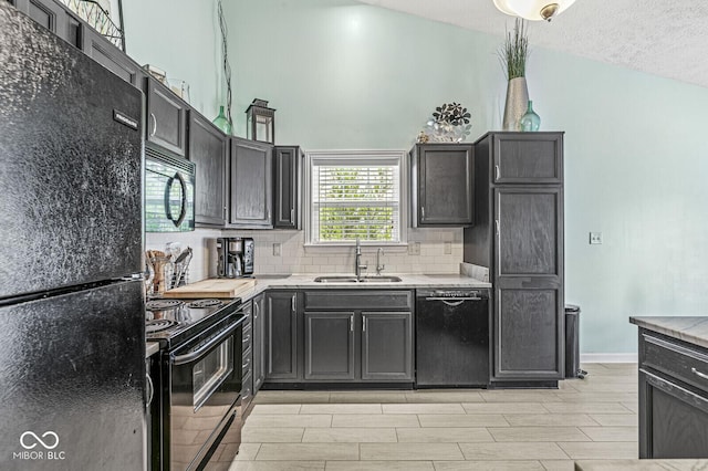 577 Austrian Way, Avon, IN 46123 - kitchen featuring black appliances, decorative backsplash, wood finish floors, and a towering ceiling