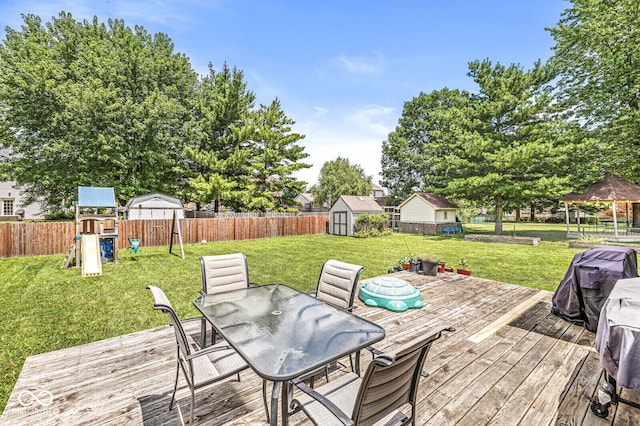 577 Austrian Way, Avon, IN 46123 - wooden terrace featuring outdoor dining space, a shed, a playground, a gazebo, and a fenced backyard