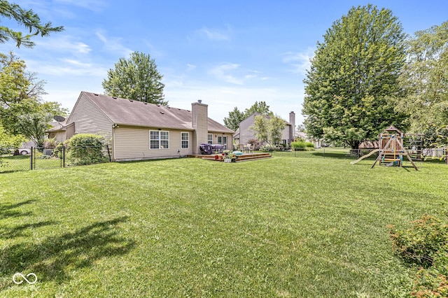 577 Austrian Way, Avon, IN 46123 - fenced backyard featuring a playground and a wooden deck