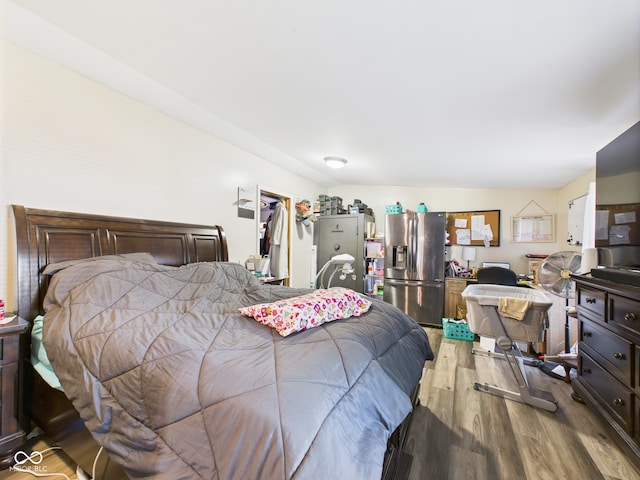 401 S Fletcher St, Frankton, IN 46044 - bedroom with stainless steel fridge, wood finished floors, and a walk in closet