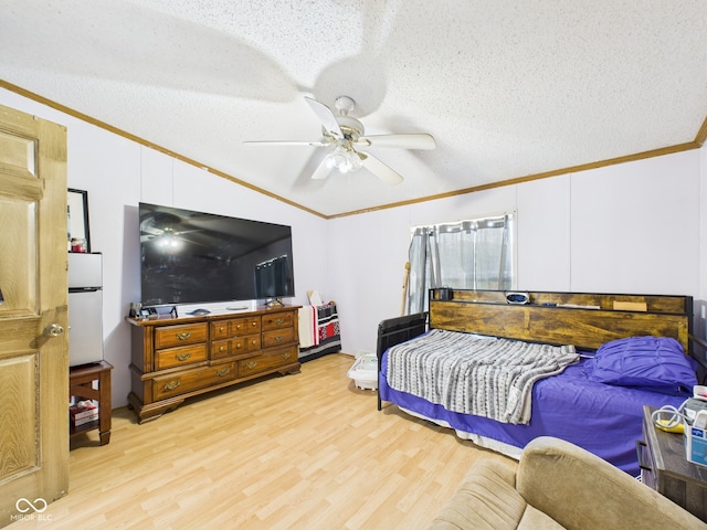 401 S Fletcher St, Frankton, IN 46044 - bedroom featuring crown molding, wood finished floors, lofted ceiling, a textured ceiling, and ceiling fan