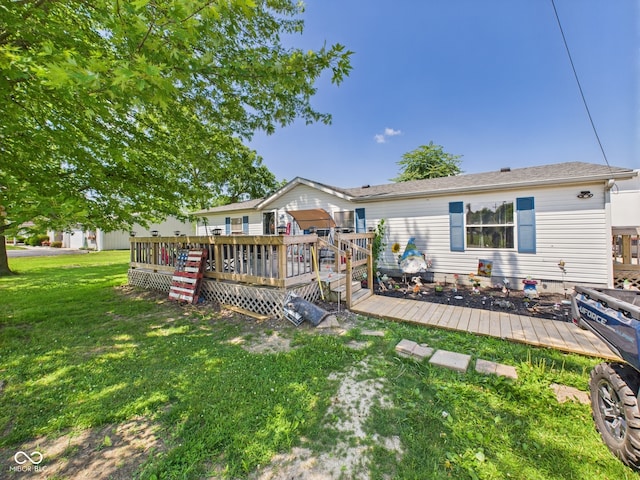 401 S Fletcher St, Frankton, IN 46044 - back of house featuring a wooden deck and a lawn