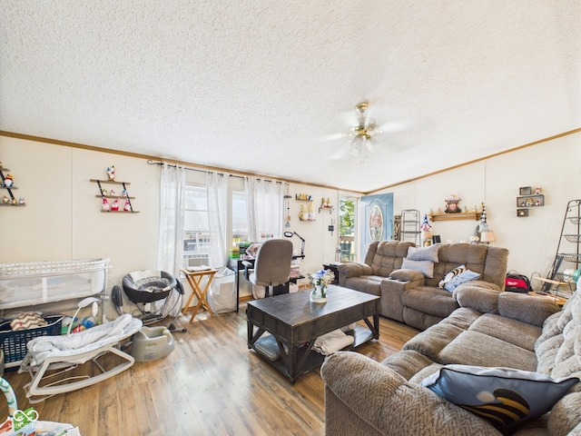 401 S Fletcher St, Frankton, IN 46044 - living room featuring crown molding, a textured ceiling, wood finished floors, ceiling fan, and lofted ceiling