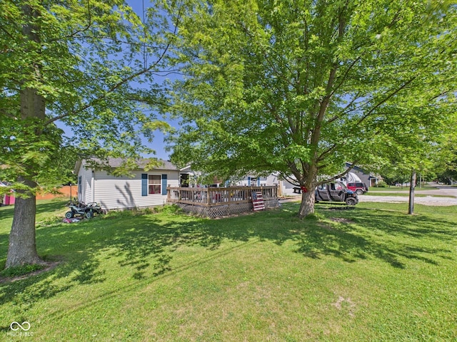 401 S Fletcher St, Frankton, IN 46044 - view of grassy yard with a wooden deck