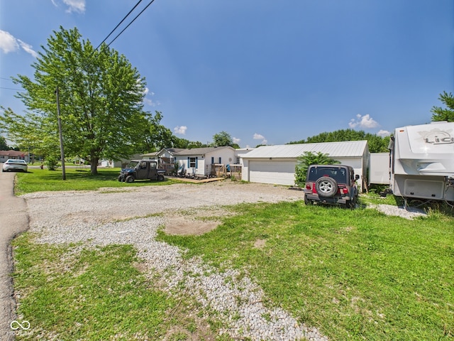 401 S Fletcher St, Frankton, IN 46044 - view of front of house featuring a front yard and a garage