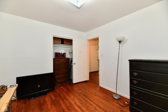 8921 E 21st St, Indianapolis, IN 46219 - bedroom with wood finished floors and a closet