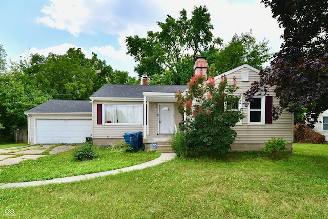 8921 E 21st St, Indianapolis, IN 46219 - view of front of house with a garage, a front lawn, a chimney, and concrete driveway