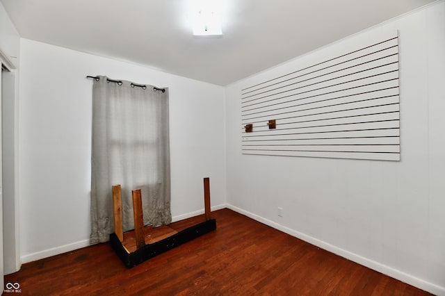 8921 E 21st St, Indianapolis, IN 46219 - spare room featuring wood finished floors and baseboards