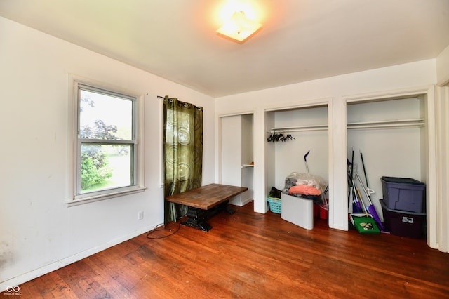8921 E 21st St, Indianapolis, IN 46219 - bedroom with wood finished floors and multiple closets