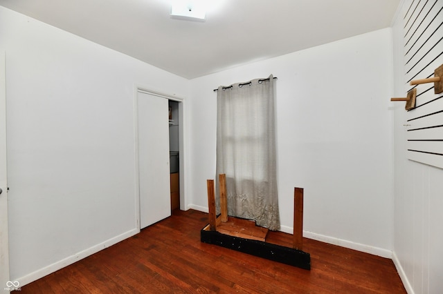8921 E 21st St, Indianapolis, IN 46219 - unfurnished bedroom featuring wood finished floors and a closet