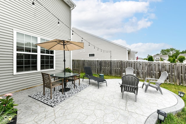 6819 Park Grove Blvd, Whitestown, IN 46075 - fenced backyard with a patio area and outdoor dining area