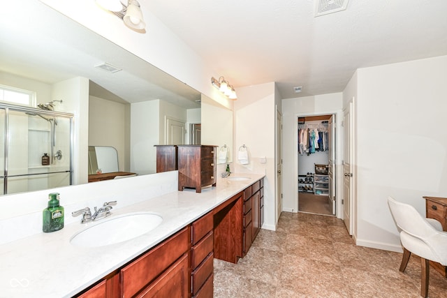 6819 Park Grove Blvd, Whitestown, IN 46075 - full bathroom featuring double vanity, a walk in closet, and an enclosed shower