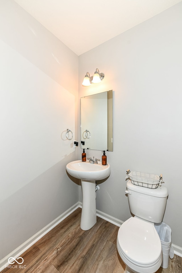 6819 Park Grove Blvd, Whitestown, IN 46075 - half bathroom featuring wood finished floors and toilet