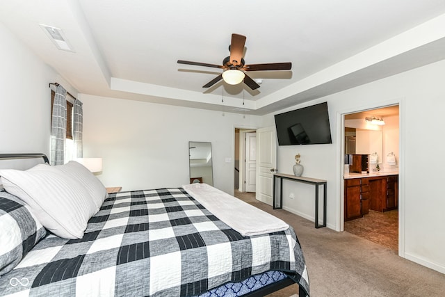 6819 Park Grove Blvd, Whitestown, IN 46075 - bedroom featuring a tray ceiling, carpet, a ceiling fan, and ensuite bathroom