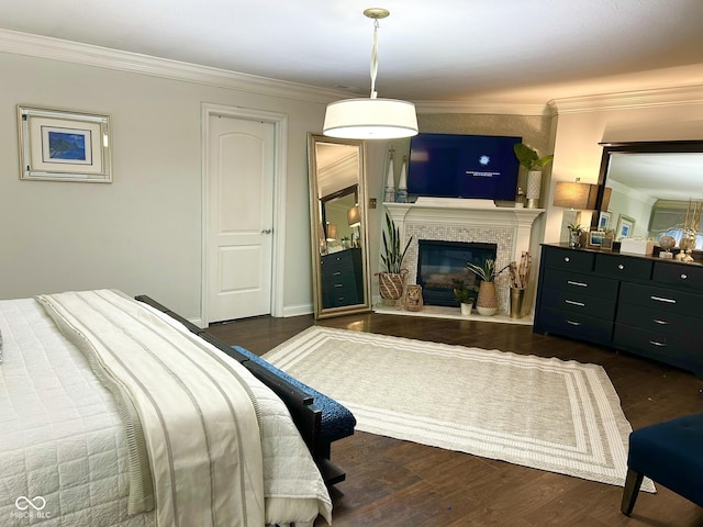 16424 Brookhollow Dr, Noblesville, IN 46062 - bedroom with ornamental molding, dark wood-type flooring, and a glass covered fireplace