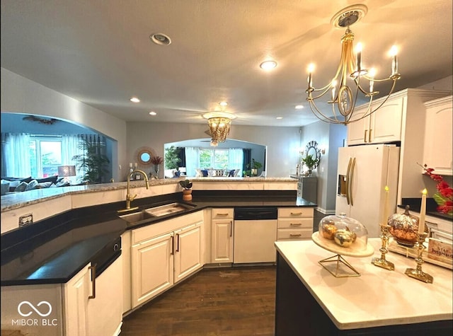 16424 Brookhollow Dr, Noblesville, IN 46062 - kitchen featuring white appliances, recessed lighting, a chandelier, dark wood finished floors, and open floor plan