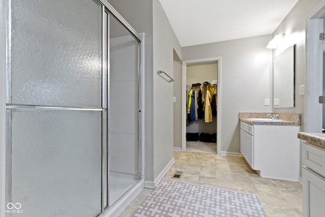 5776 Blue Sky Dr, Whitestown, IN 46075 - bathroom featuring vanity, a stall shower, and a spacious closet