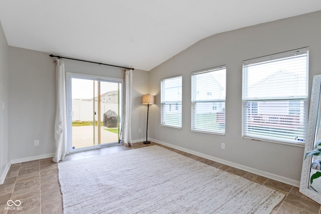 5776 Blue Sky Dr, Whitestown, IN 46075 - unfurnished room with healthy amount of natural light, lofted ceiling, and light tile patterned floors