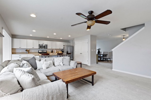 5776 Blue Sky Dr, Whitestown, IN 46075 - living area featuring light carpet, ceiling fan, and recessed lighting