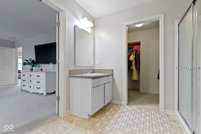 5776 Blue Sky Dr, Whitestown, IN 46075 - bathroom with vanity, a stall shower, and a spacious closet