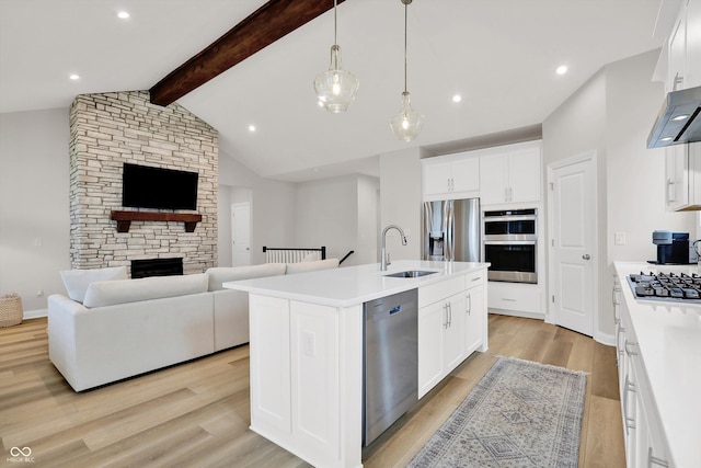 15744 Kohut Ln, Westfield, IN 46074 - kitchen with stainless steel appliances, open floor plan, light countertops, a center island with sink, and recessed lighting