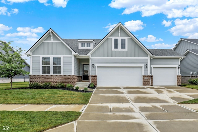 15744 Kohut Ln, Westfield, IN 46074 - craftsman-style house with brick siding, board and batten siding, a front yard, driveway, and a shingled roof