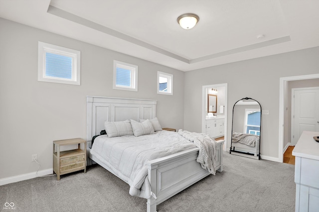 15744 Kohut Ln, Westfield, IN 46074 - bedroom with a tray ceiling, light colored carpet, and ensuite bathroom