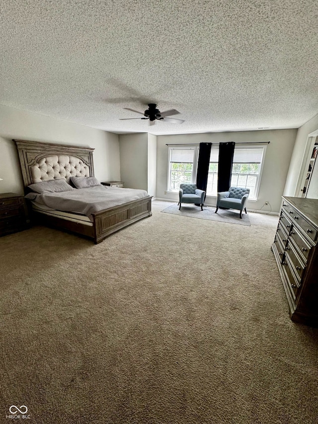 12583 Courage Xing, Fishers, IN 46037 - bedroom featuring carpet flooring, a textured ceiling, and a ceiling fan