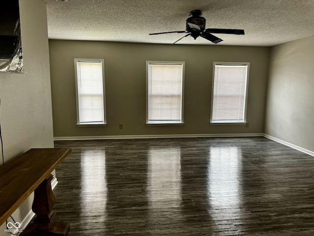 12583 Courage Xing, Fishers, IN 46037 - unfurnished room with a ceiling fan, healthy amount of natural light, wood finished floors, and a textured ceiling