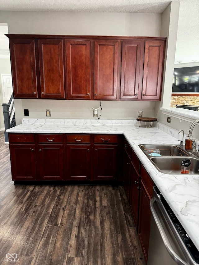 12583 Courage Xing, Fishers, IN 46037 - kitchen featuring dark brown cabinets, dark wood finished floors, stainless steel dishwasher, light stone countertops, and a textured ceiling